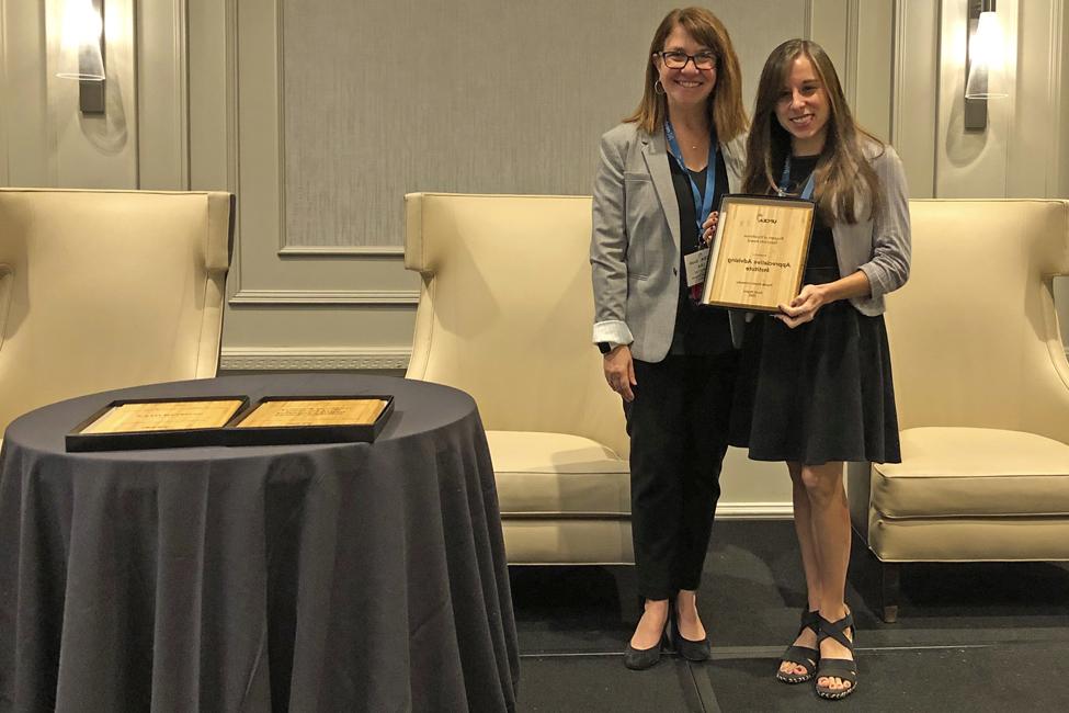 Ashley Brannan, OAE Coordinator, and UPCEA BOD President Lisa Templeton with the award.